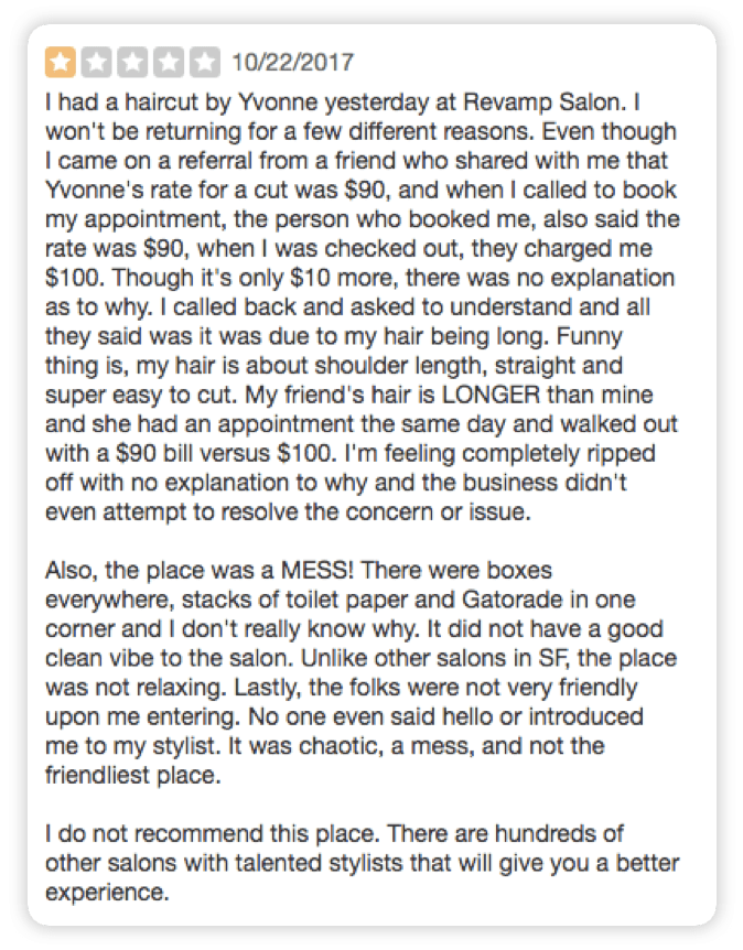 A one-star review of Revamp Salon, in which the customer says she was charged $10 more than she expected, without a clear explanation. She goes on to describe the salong as "a mess," noting stacks of boxes, toilet paper, and Gatorade in the shop.