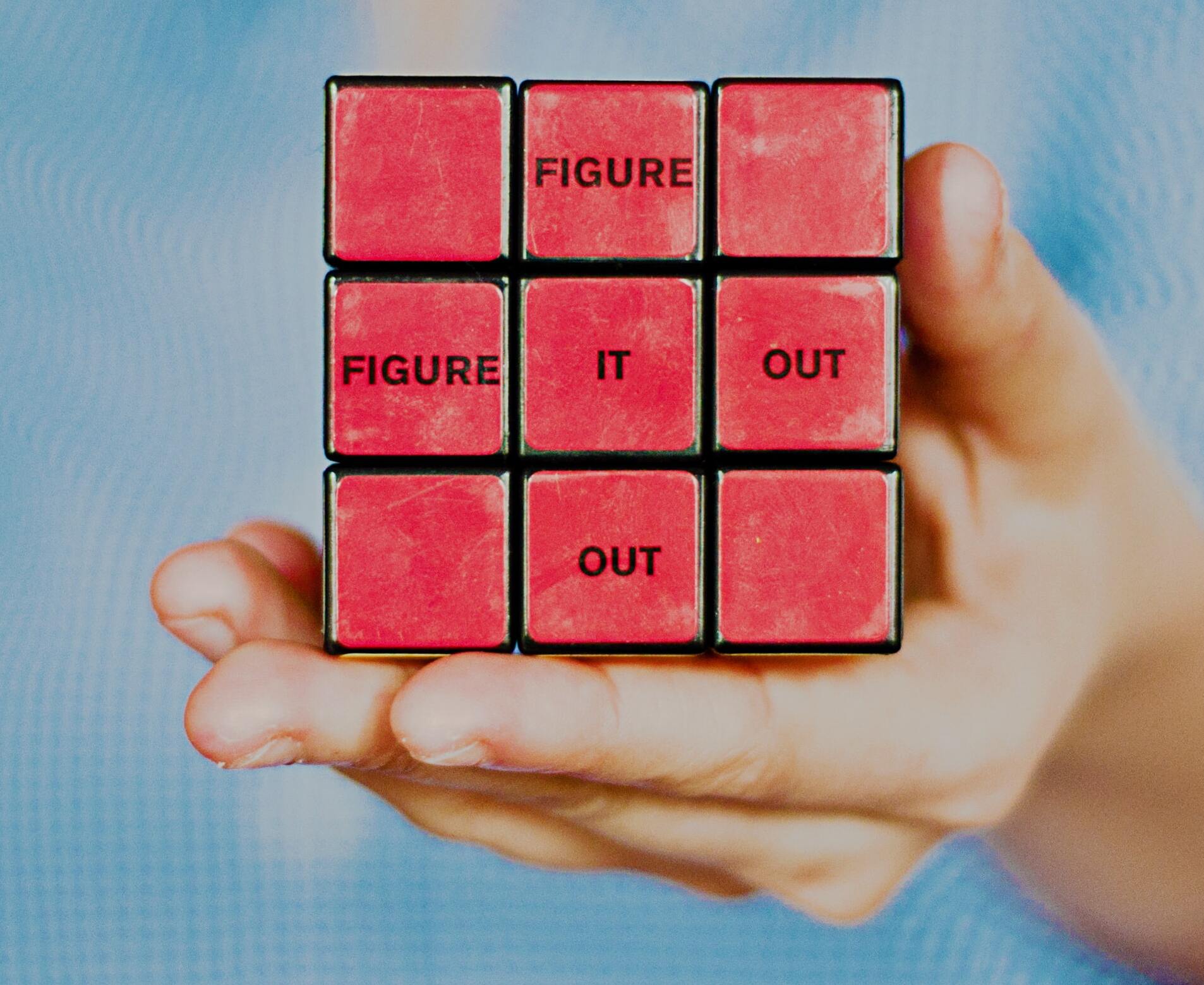 Rubik's cube with the words "figure it out"