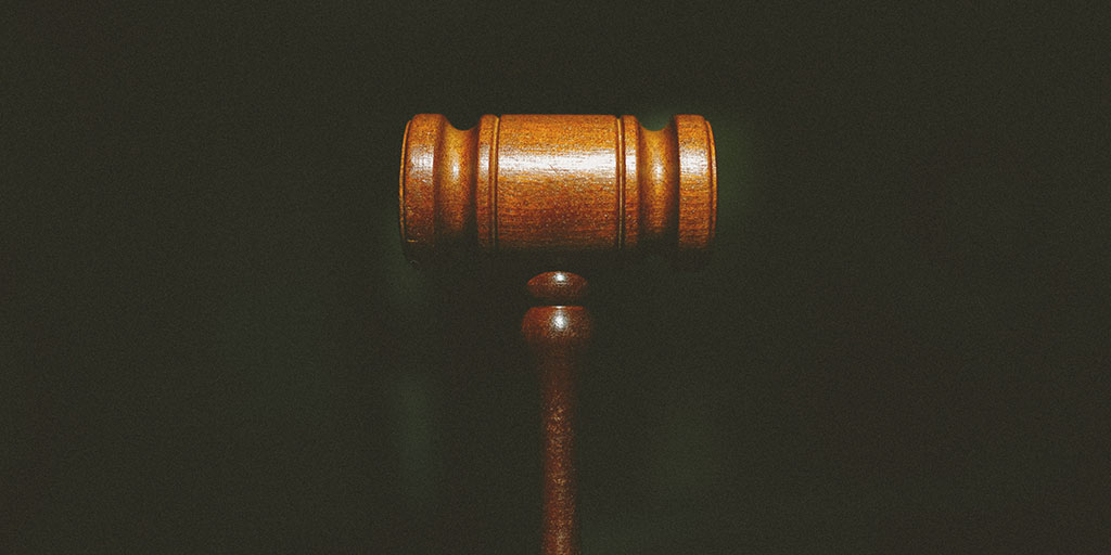 a brown gavel on a black background