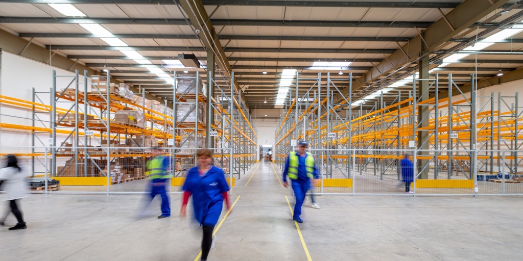 A picture of people walking in a manufacturing unit