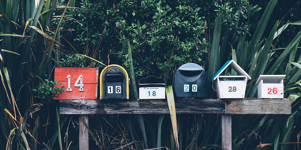 A row of physical mailboxes