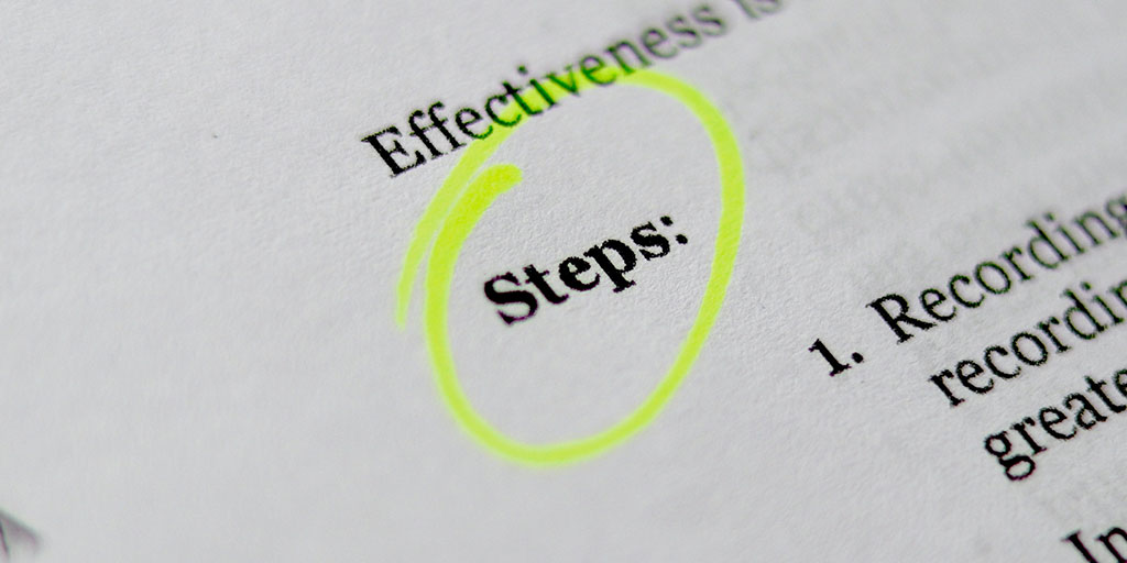 close up photo of a paper-based instruction manual with the word Steps circled with a highlighter